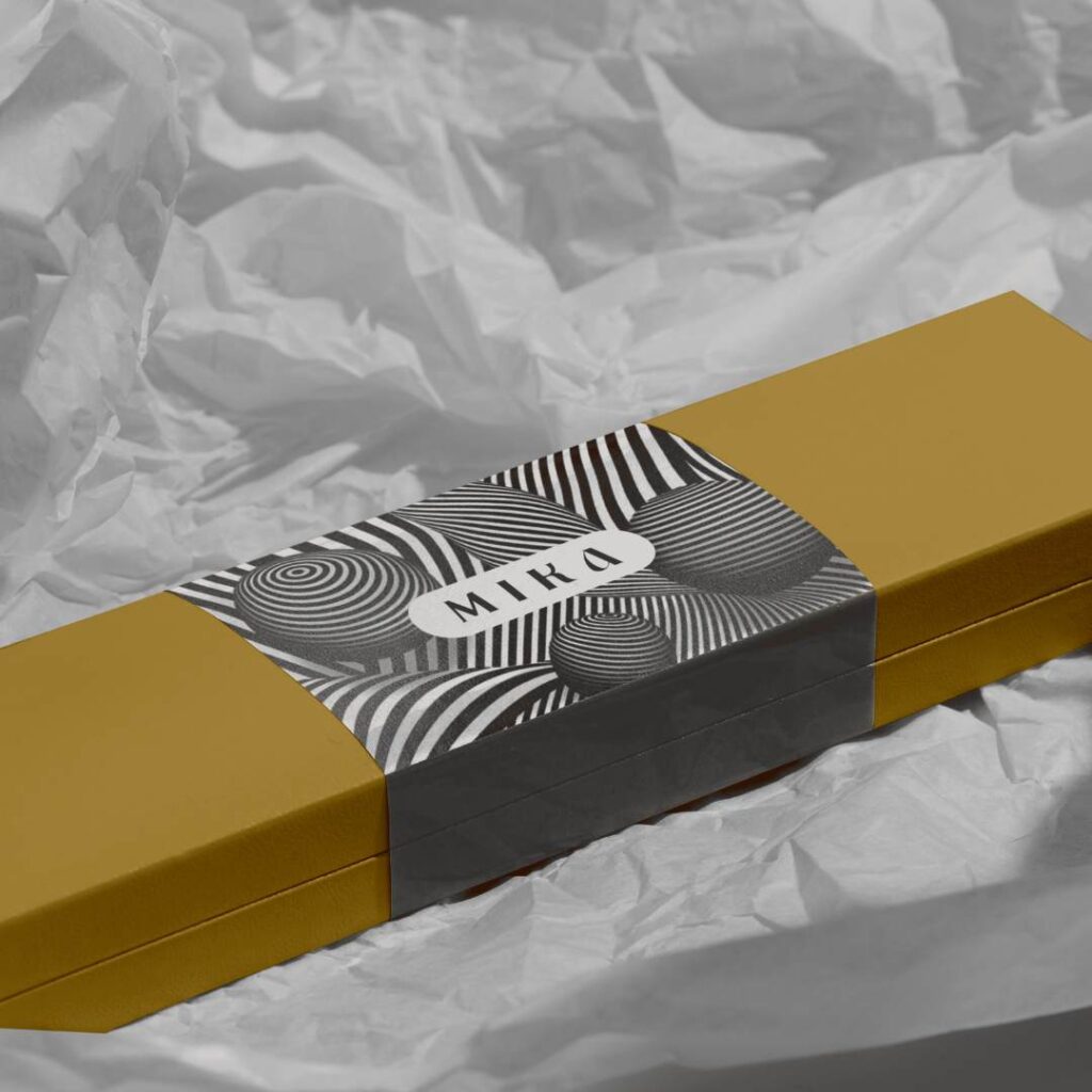 A sleek and modern jewelry packaging design for men, featuring a masculine color scheme and elegant typography.